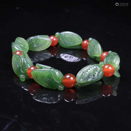 A HETIAN GREEN JADE CARVED BRACELET