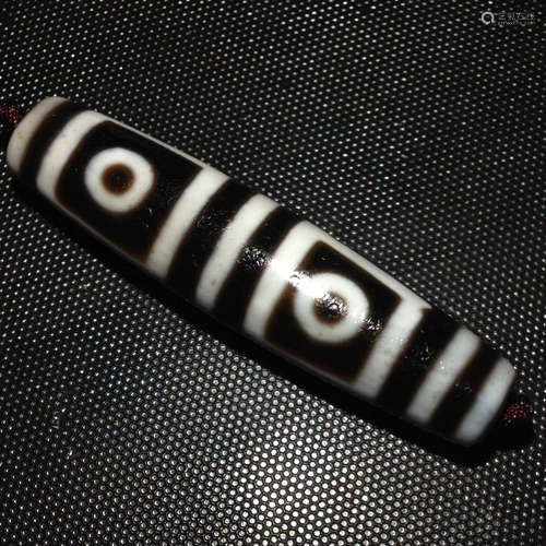 A FOUR-EYE DZI BEAD