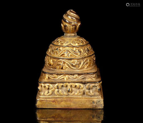 A GILT BRONZE CARVED SEAL SHAPED PENDANT