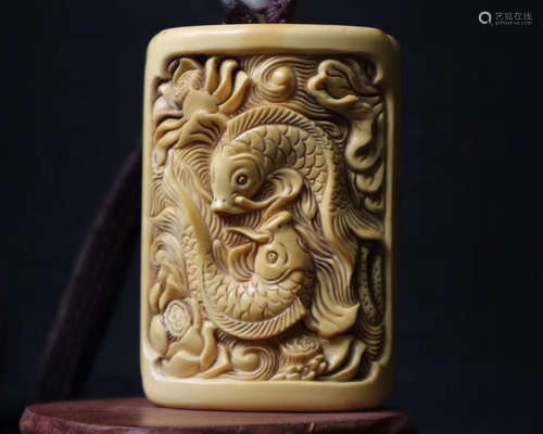 A XY CARVED LOTUS & FISH PENDANT