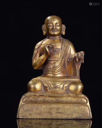 A QING GILT BRONZE CARVED LUOHAN FIGURE