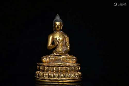 17 C., A Gilt Bronze Buddha Statue