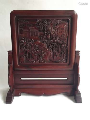 A Carved Hardwood Plaque