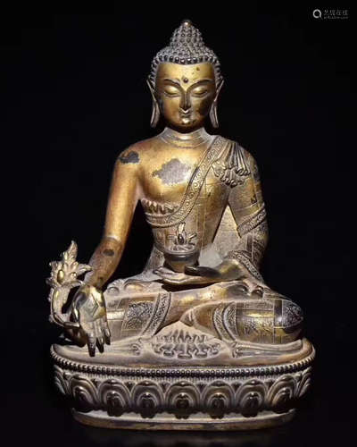 A BRONZE GLITED BUDDHA