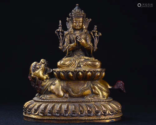 A BRONZE GLITED BUDDHA FIGURE