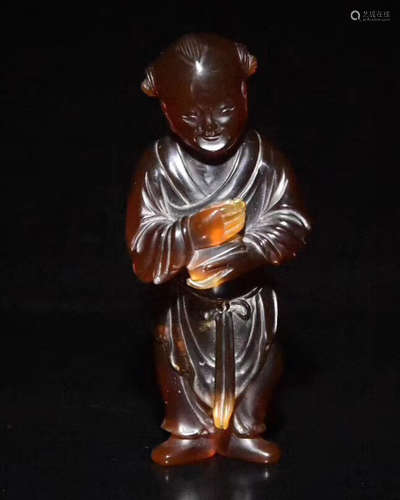 AN AMBER CHILD FIGURE