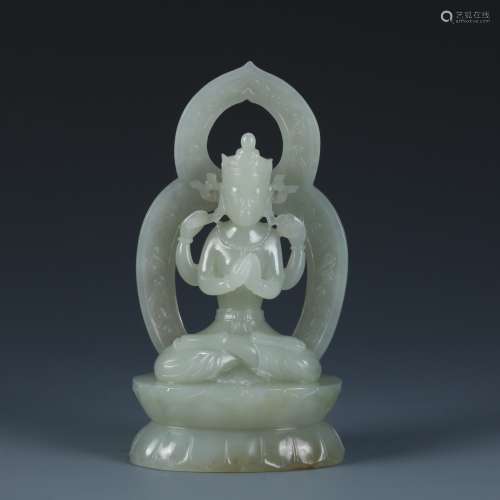 A White Jade Buddhist Figure Of Four-Armed Sadaksari