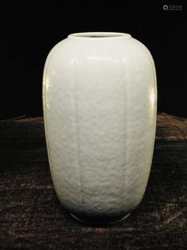 A pale blue-glazed lobed ovoid vase