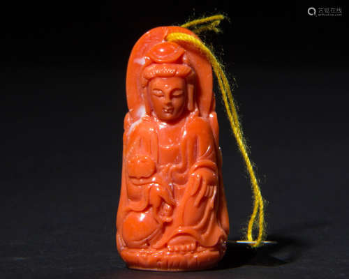 A CORAL CARVED GUANYIN PENDANT
