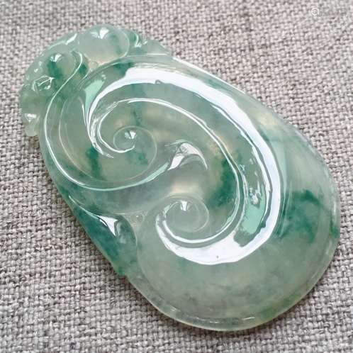 A NATURAL PIAOHUA RUYI-SHAPED JADEITE PENDANT