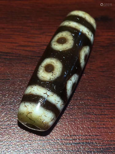 AN OLD ORE CHARGE EIGHT-EYE DZI BEAD