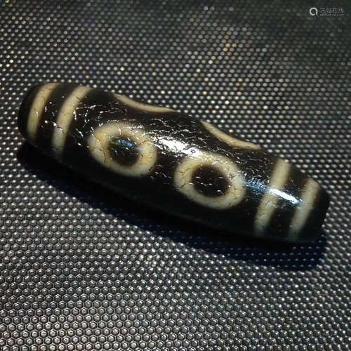 AN OLD ORE CHARGE EIGHT-EYE DZI BEAD