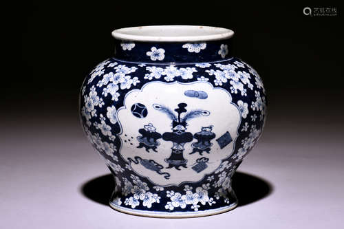 A KANGXI PERIOD JAR DECORATED WITH PLUM FLOWERS IN AN INTENSE UNDERGLAZE BLUE GROUND