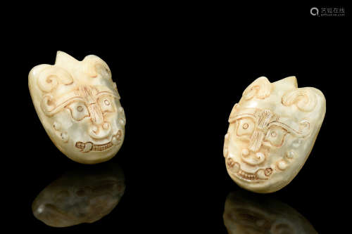 PAIR OF JADE CARVED 'MASK' ORNAMENTS