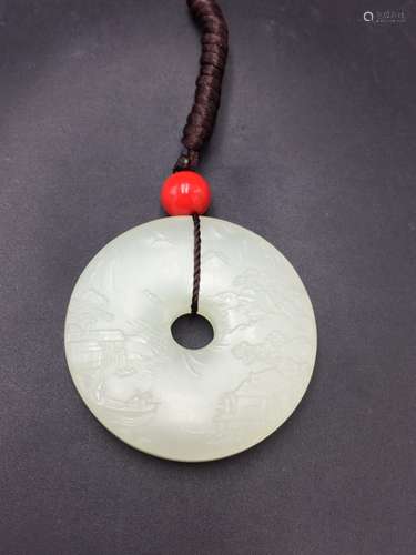 A NATURAL RING-SHAPED HETIAN JADE PENDANT