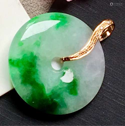 A NATURAL RING-SHAPED PIAOLV JADEITE PENDANT