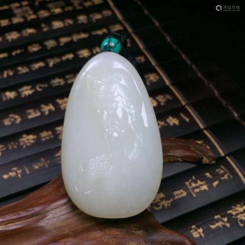 A NATURAL HETIAN JADE PENDANT