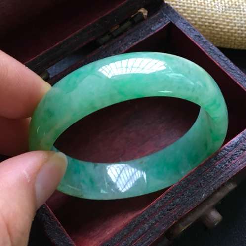 A NATURAL JADEITE BANGLE