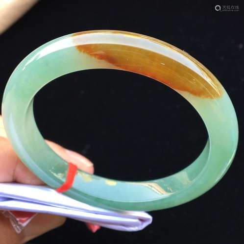 A NATURAL YELLOW JADEITE BANGLE