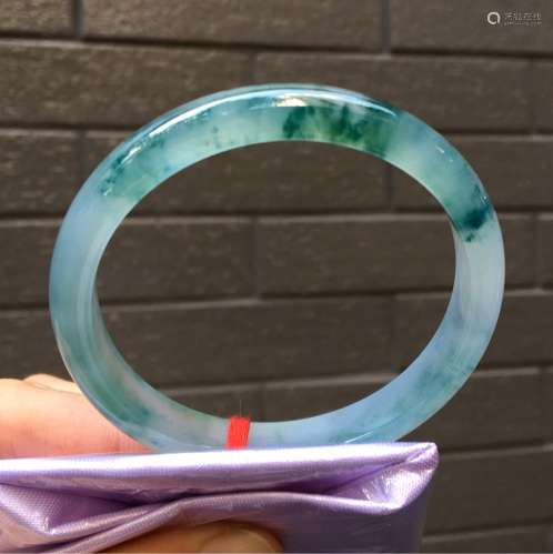 A NATURAL PIAOHUA JADEITE BANGLE