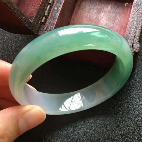 A NATURAL JADEITE BANGLE