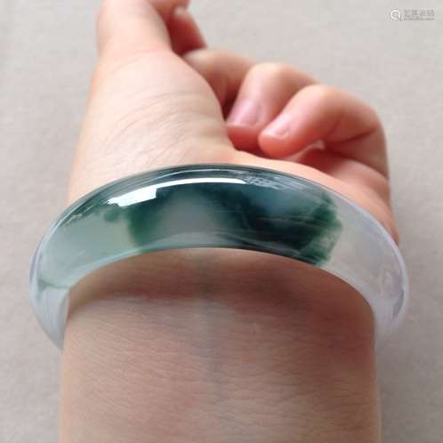 A NATURAL PIAOHUA JADEITE BANGLE