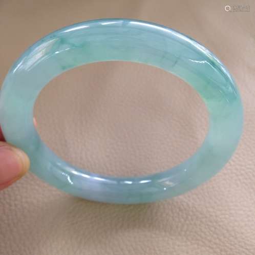 A NATURAL JADEITE BANGLE