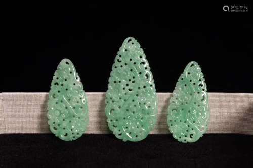 A SET OF OLD JADE PENDENTS