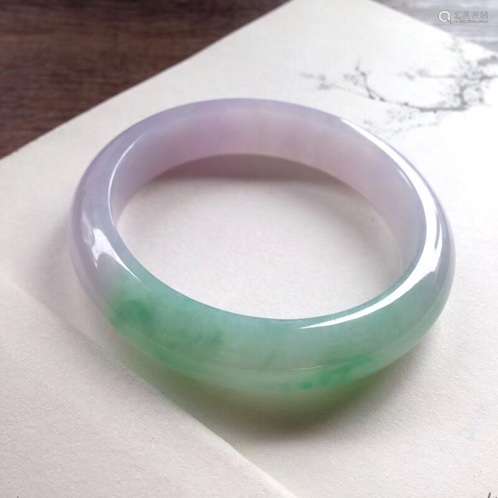 A NATURAL JADEITE BANGLE