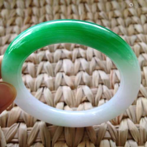 A NATURAL JADEITE BANGLE