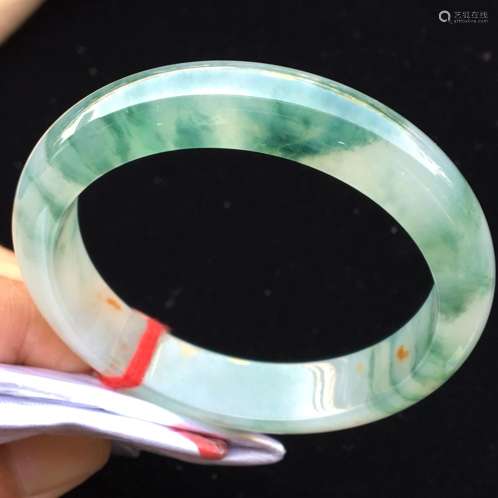 A NATURAL PIAOHUA JADEITE BANGLE