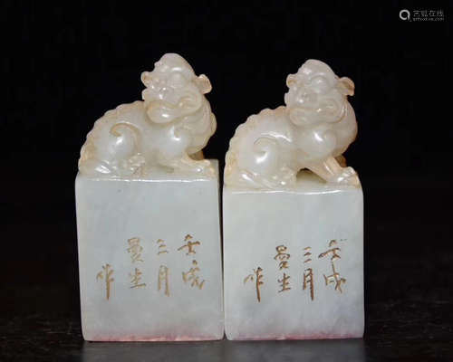 PAIR OF WHITE STONE SEALS