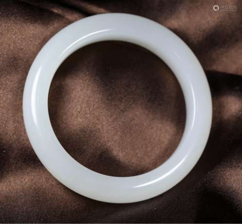 A NATURAL HETIAN JADE BANGLE