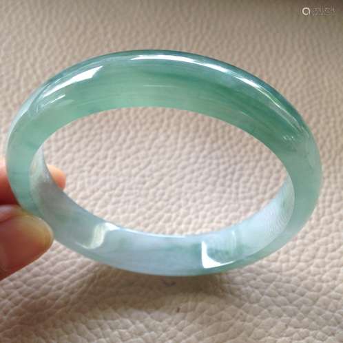 A NATURAL PIAOHUA JADEITE BANGLE