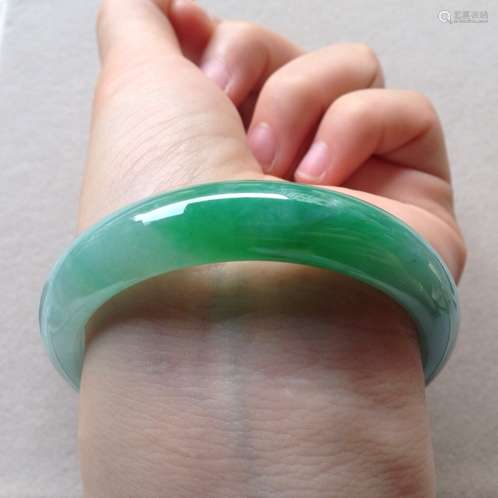 A NATURAL JADEITE BANGLE