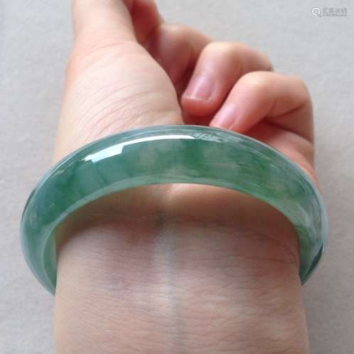 A NATURAL PIAOHUA JADEITE BANGLE