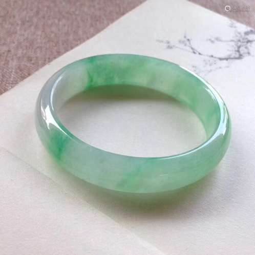 A NATURAL YANGLV JADEITE BANGLE