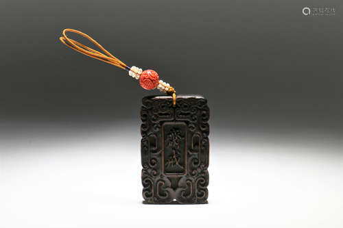 A Chinese Carved Wood Pendant