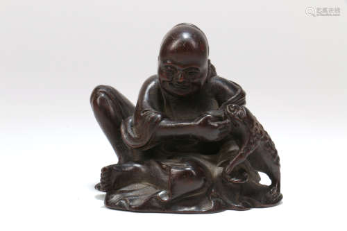A Chinese Carved Hard Wood Figure 