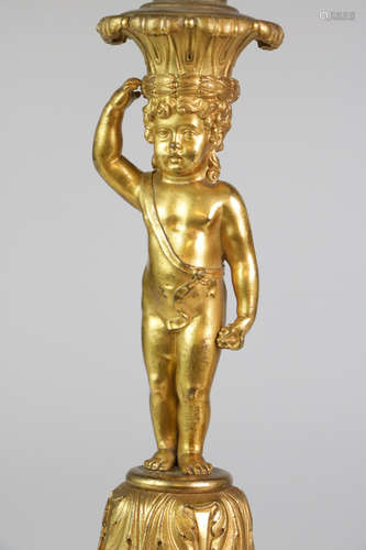 Pair of bronze putti candle sticks