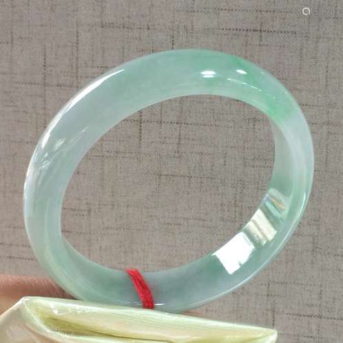 A NATURAL  JADEITE BANGLE