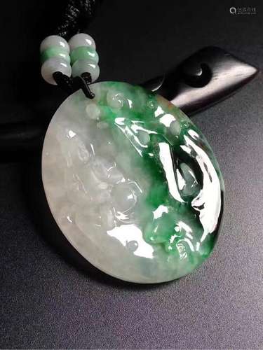 A NATURAL   JADEITE GUANYIN DESIGN PENDANT