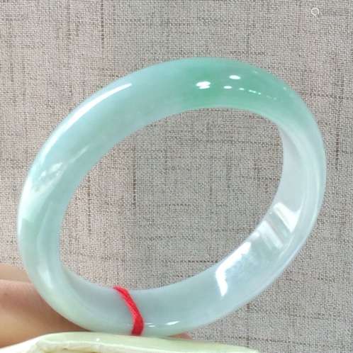 A NATURAL  JADEITE BANGLE