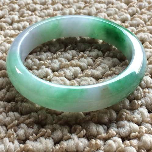 A NATURAL  JADEITE BANGLE