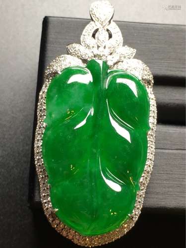 A NATURAL  MANLV  JADEITE LEAF-SHAPED PENDANT