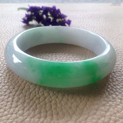 A NATURAL   JADEITE BANGLE