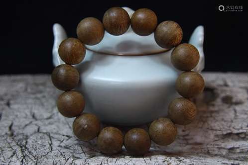 A STRING OF EAGLEWOOD BUDDHA BEADS