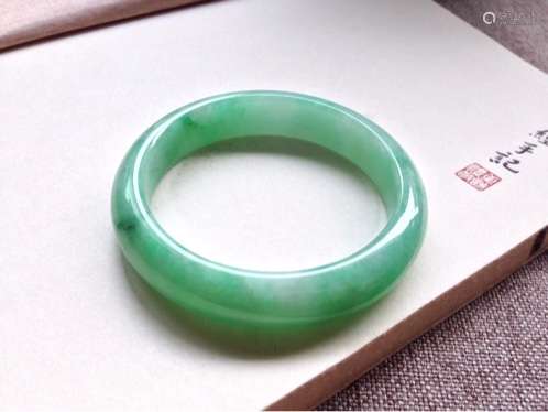 A NATURAL  JADEITE BANGLE