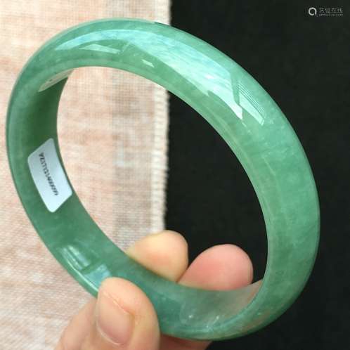 A NATURAL  JADEITE BANGLE