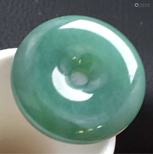 A NATURAL YOUQING  JADEITE RING-SHAPED PENDANT